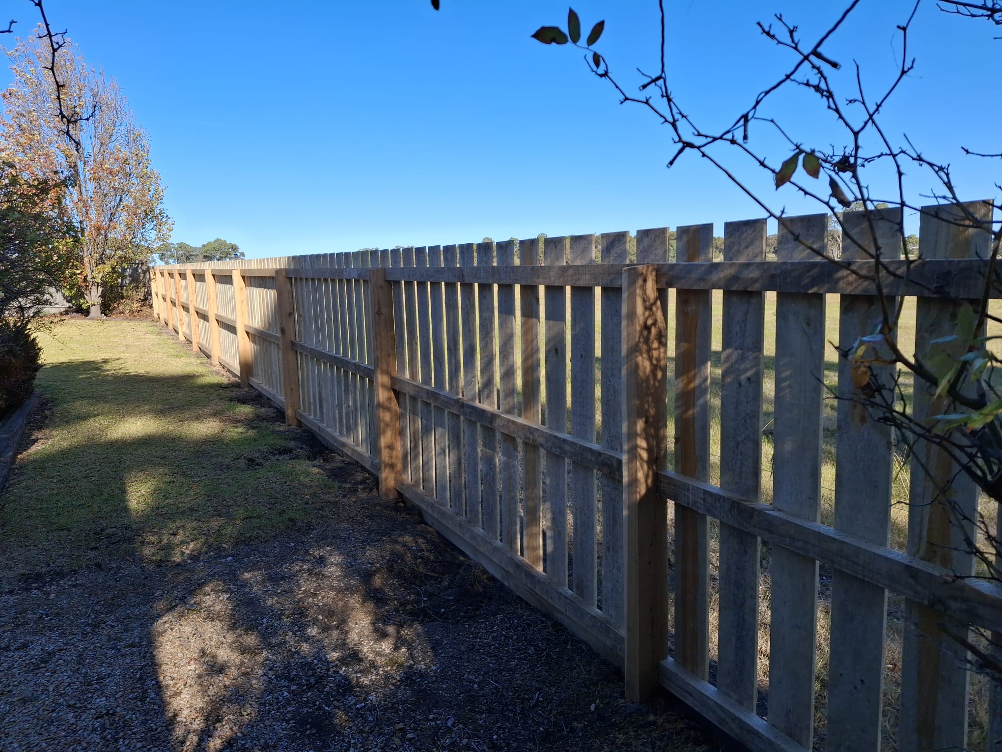 Traditional timber picket fence